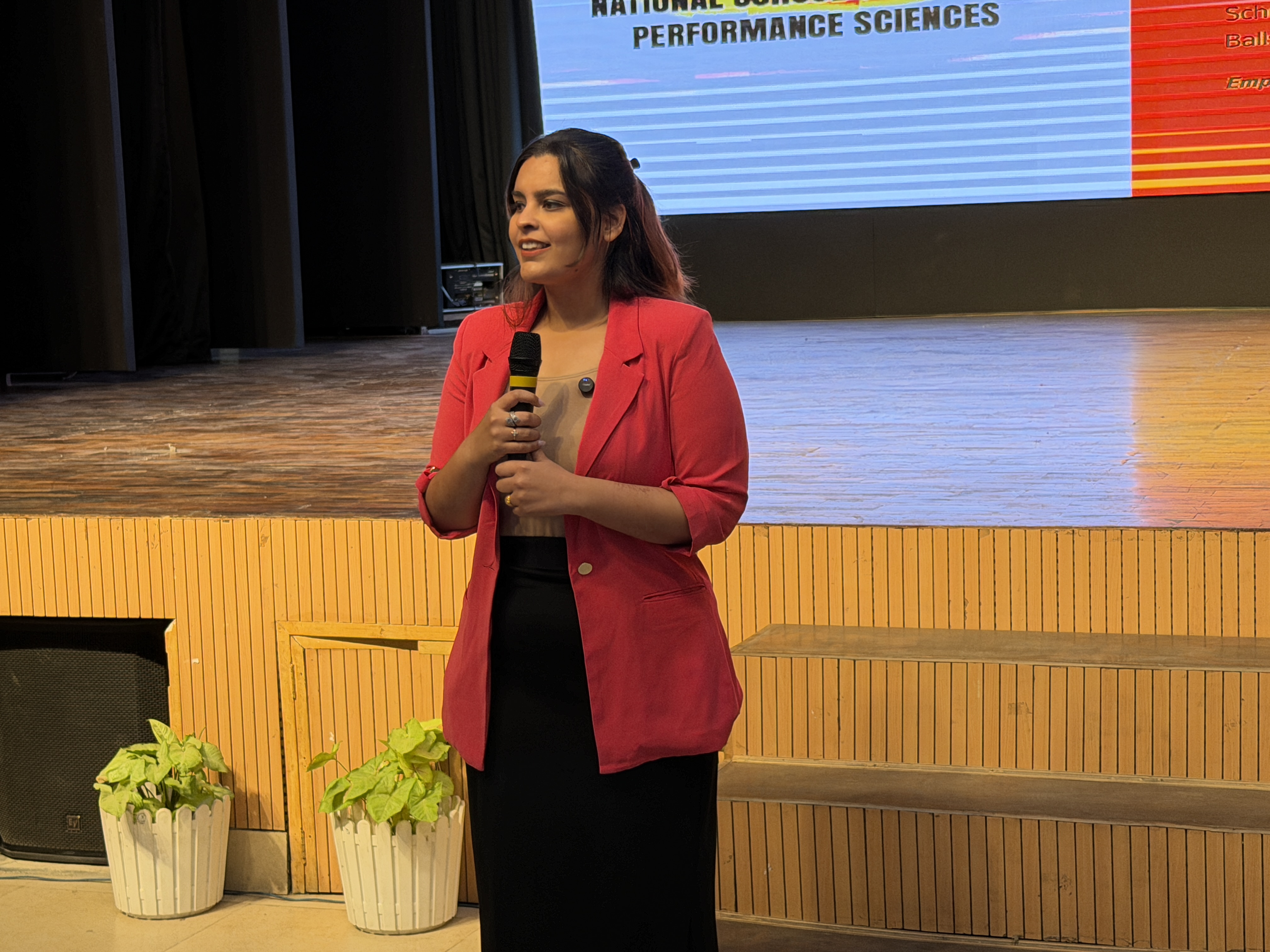 Kashika Bhatia speaking on stage